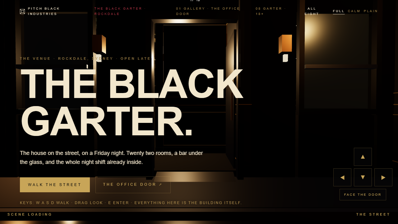 The Black Garter lit at night, seen from across the street